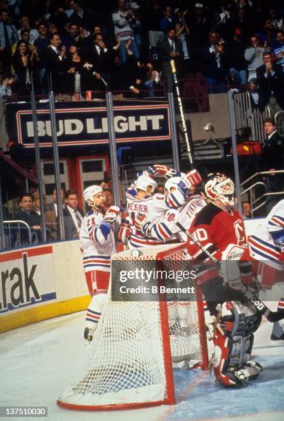 Mark Messier, Esa Tikkanen and Sergei Zubov of the New York Rangers celebrate their goal against goalie Martin Brodeur of the New Jersey Devils...