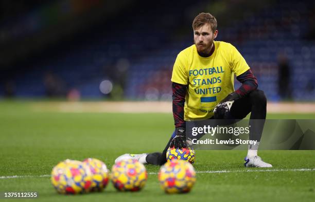 Will Norris of Burnley wears a Ukrainian t-shirt to indicate peace and sympathy with Ukraine prior to the Premier League match between Burnley and...