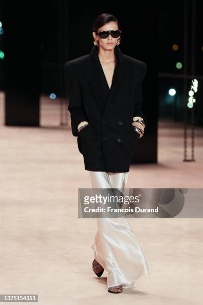 Model walks the runway during the Saint Laurent Womenswear Fall/Winter 2022-2023 show as part of Paris Fashion Week on March 01, 2022 in Paris,...