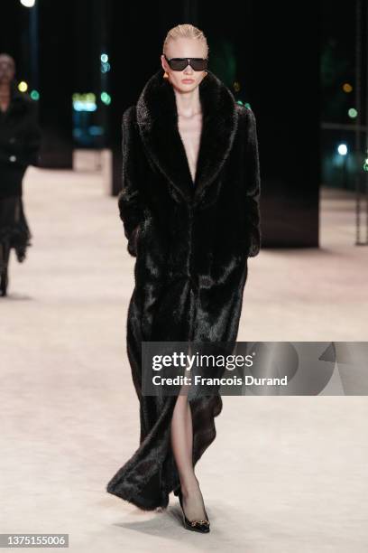 Model walks the runway during the Saint Laurent Womenswear Fall/Winter 2022-2023 show as part of Paris Fashion Week on March 01, 2022 in Paris,...