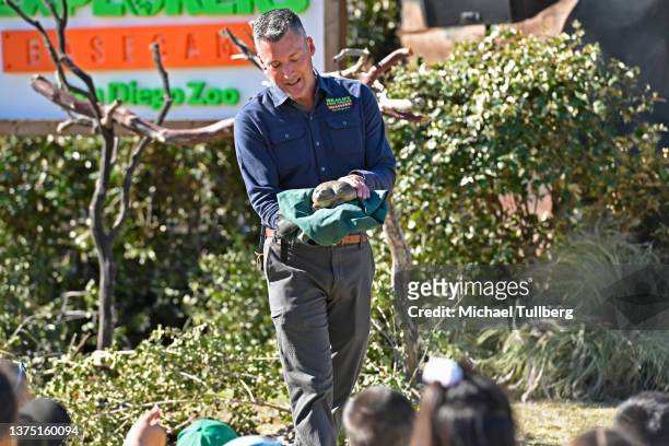 San Diego Zoo Ambassador Rick Schwartz presents a pixie frog to Los Angeles area school children at the unveiling of the world's largest puppet Percy...