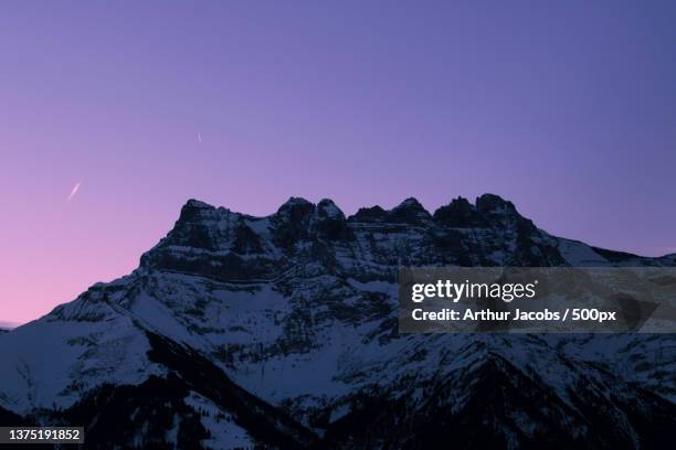 sunrise over the dents du midi,dents du midi,switzerland - dents du midi stock-fotos und bilder