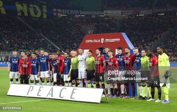 Players and officials pose for a photo in front of a peace sign to indicate peace and sympathy with Ukraine prior to the Coppa Italia Semi Final 1st...