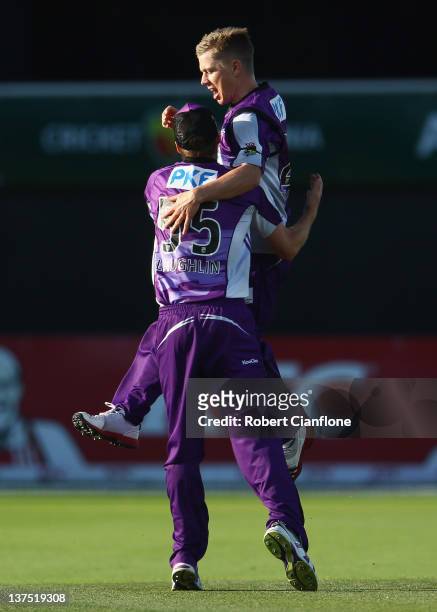 Xavier Doherty of the Hurricanes celebrates with Ben Laughlin after taking the wicket of Moises Henriques of the Sydney 6ers during the T20 Big Bash...