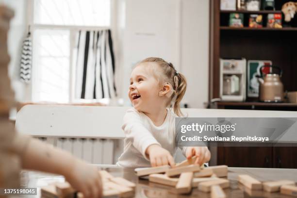 toddler with cochlear implants having fun - implantat bildbanksfoton och bilder