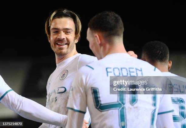 Jack Grealish of Manchester City celebrates after scoring their team's second goal during the Emirates FA Cup Fifth Round match between Peterborough...