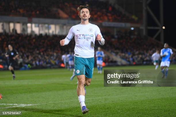 Jack Grealish of Manchester City celebrates after scoring their team's second goal during the Emirates FA Cup Fifth Round match between Peterborough...