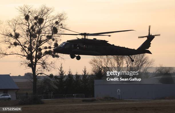 Black Hawk military helicopter of the U.S. Army arrives for refueling at an airfield currently being used by the Army's 82nd Airborne Division on...