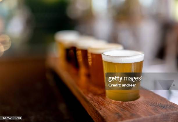 close-up of a beer tasting sampler - destilação imagens e fotografias de stock