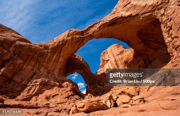 double arch,low angle view of rock formation - rock formation isolated stock pictures, royalty-free photos & images