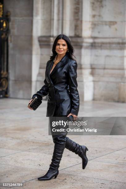 Victoria Barbara seen wearing black vegan leather blazer, pants, boots, clutch outside Nanushka during Paris Fashion Week - Womenswear F/W 2022-2023...