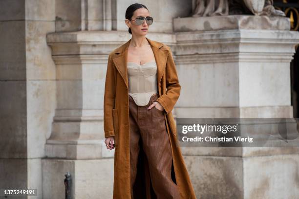 Alexandra Guerain seen wearing brown suede coat, brown pants, off shoulder top, sunglasses outside Nanushka during Paris Fashion Week - Womenswear...