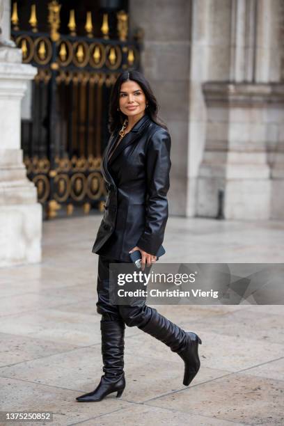 Victoria Barbara seen wearing black vegan leather blazer, pants, boots, clutch outside Nanushka during Paris Fashion Week - Womenswear F/W 2022-2023...