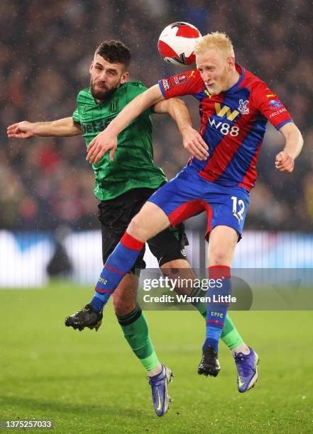Will Hughes of Crystal Palace challenges for the high ball with Tommy Smith of Stoke City during the Emirates FA Cup Fifth Round match between...