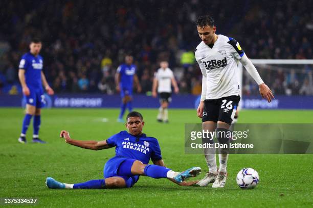 Cody Drameh of Cardiff City clears the ball from Lee Buchanan of Derby County during the Sky Bet Championship match between Cardiff City and Derby...