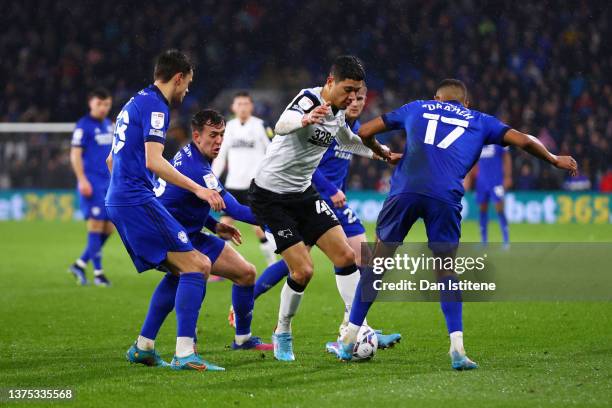 Luke Plange of Derby County attempts to find a way through the Cardiff City defence during the Sky Bet Championship match between Cardiff City and...