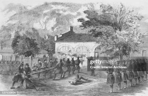 Engraving depicting United States Marines carrying a ladder to storm the engine house while insurgents fire through holes in the doors, Virginia,...