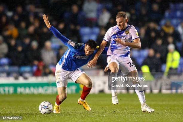 Tyler Walker of Portsmouth FC holds off Herbie Kane of Oxford United during the Sky Bet League One match between Portsmouth and Oxford United at...