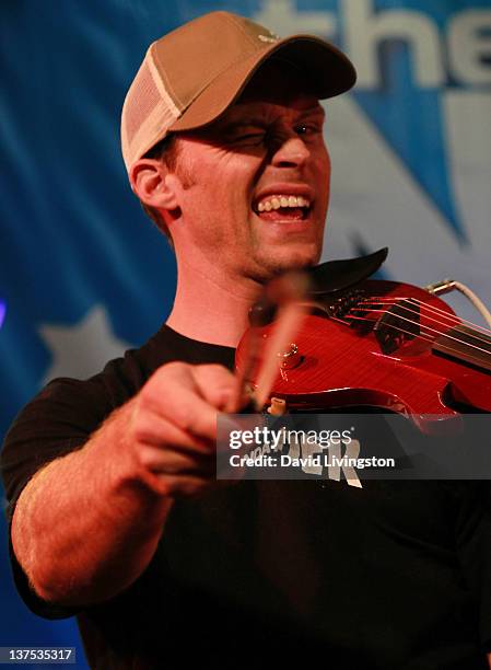 Actor Jesse Spencer performs on stage with Band From TV at the 110th NAMM Show - Day 3 at the Anaheim Convention Center on January 21, 2012 in...