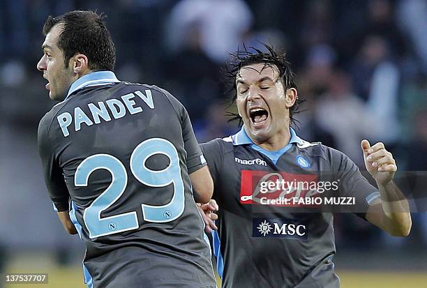 Napoli's Goran Pandev celebrates together teammate Salvatore Aronica of Uruguay after scoring against Sienna during their serie A football match at...