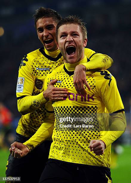 Jakub Blaszczykowski of Dortmund celebrates with team mate Moritz Leitner after scoring his teams fourth goal during the Bundesliga match between...
