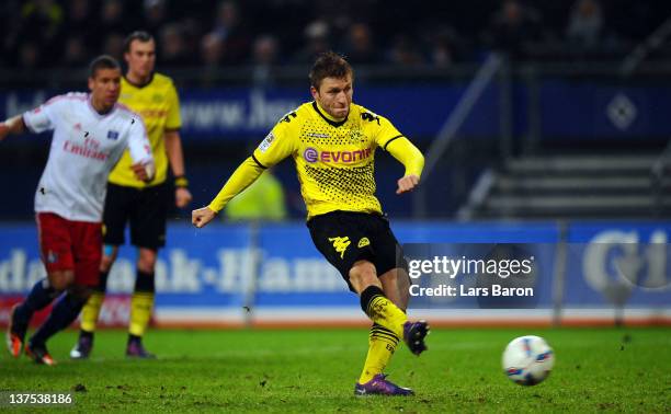 Jakub Blaszczykowski of Dortmund scores his teams fourth goal from the penalty spot during the Bundesliga match between Hamburger SV and Borussia...