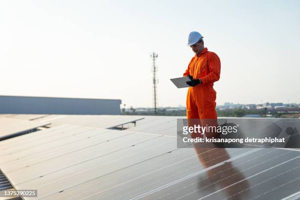Solar panel,engineer working on checking and maintenance electrical equipment