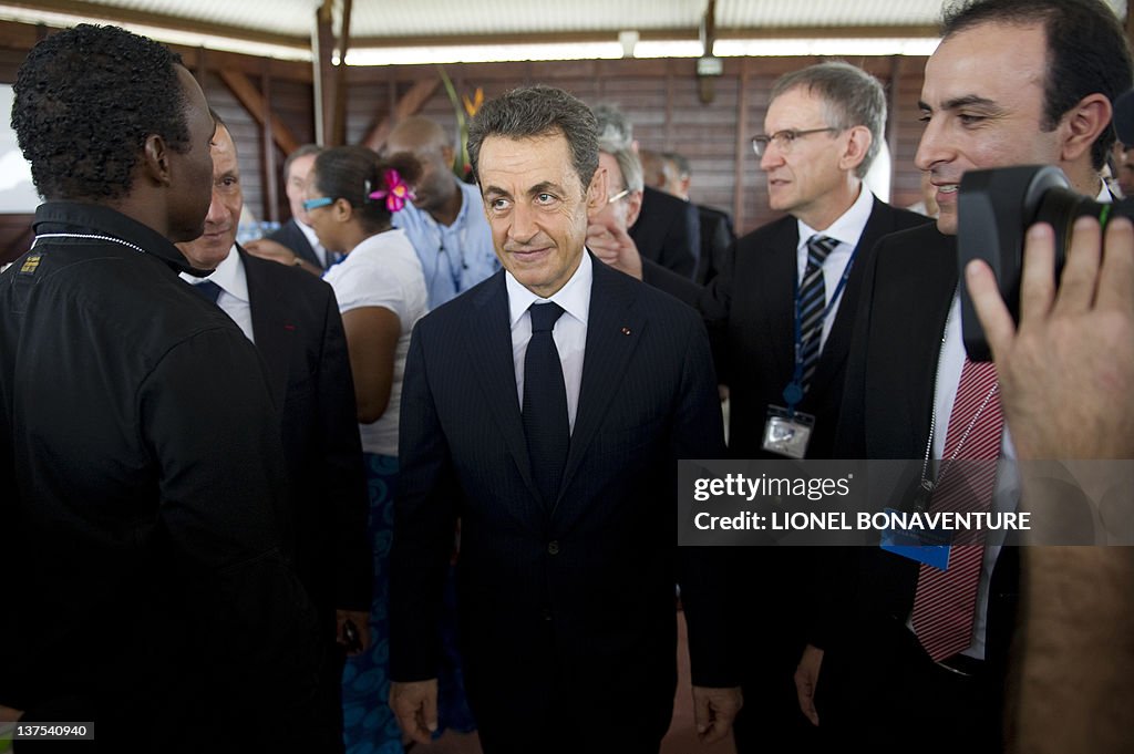 France's President Nicolas Sarkozy (C) s