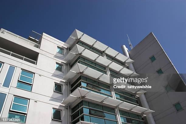 ground view of a tower of modern luxury housing - general images of property stock pictures, royalty-free photos & images