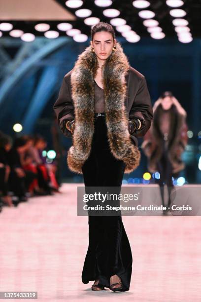 Model walks the runway during the Saint Laurent Womenswear Fall/Winter 2022-2023 show as part of Paris Fashion Week on March 01, 2022 in Paris,...