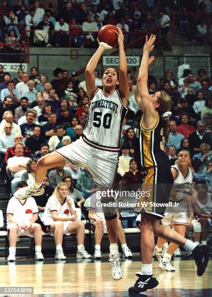 Star player Rebecca Lobo of the University of Connecticut women's basketball team shoots a jumper against Iowa, in a game at Storrs, CT, 1995.