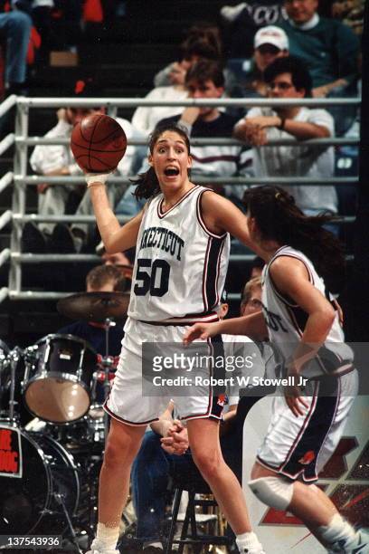 Star player Rebecca Lobo of the University of Connecticut women's basketball team grabs a rebound and looks to pass against Georgetown, Storrs, CT,...