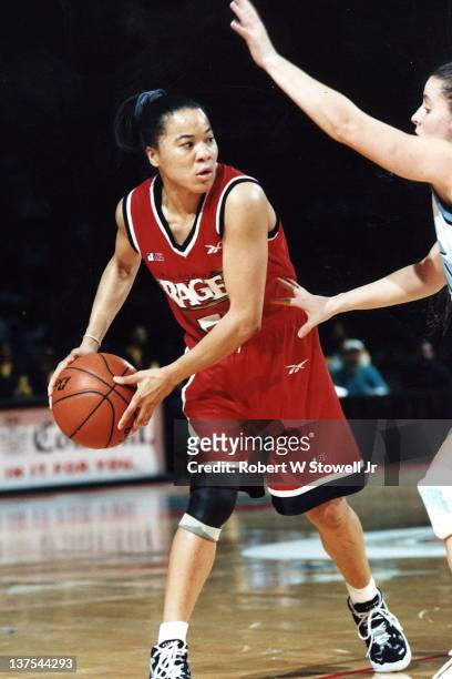 Dawn Staley, point guard for the Philadelphia Rage women's basketball team of the American Basketball League, looks to pass against the New England...