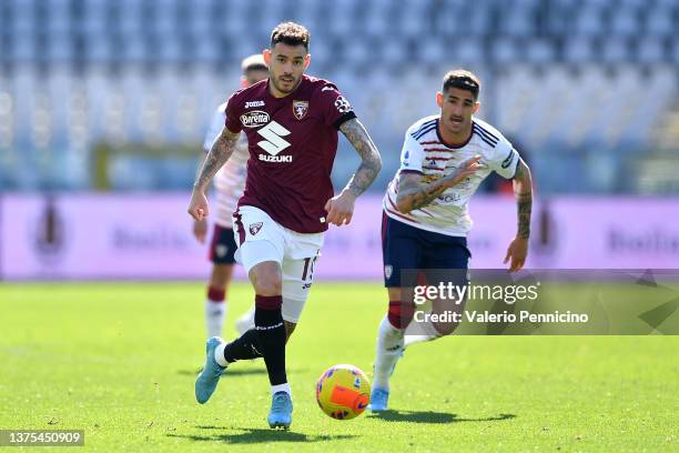 Antonio Sanabria of Torino FC in action against Alessandro Deiola of Cagliari Calcio during the Serie A match between Torino FC and Cagliari Calcio...