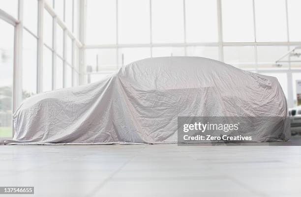 car covered in cloth in garage - car covered with cloth stock pictures, royalty-free photos & images