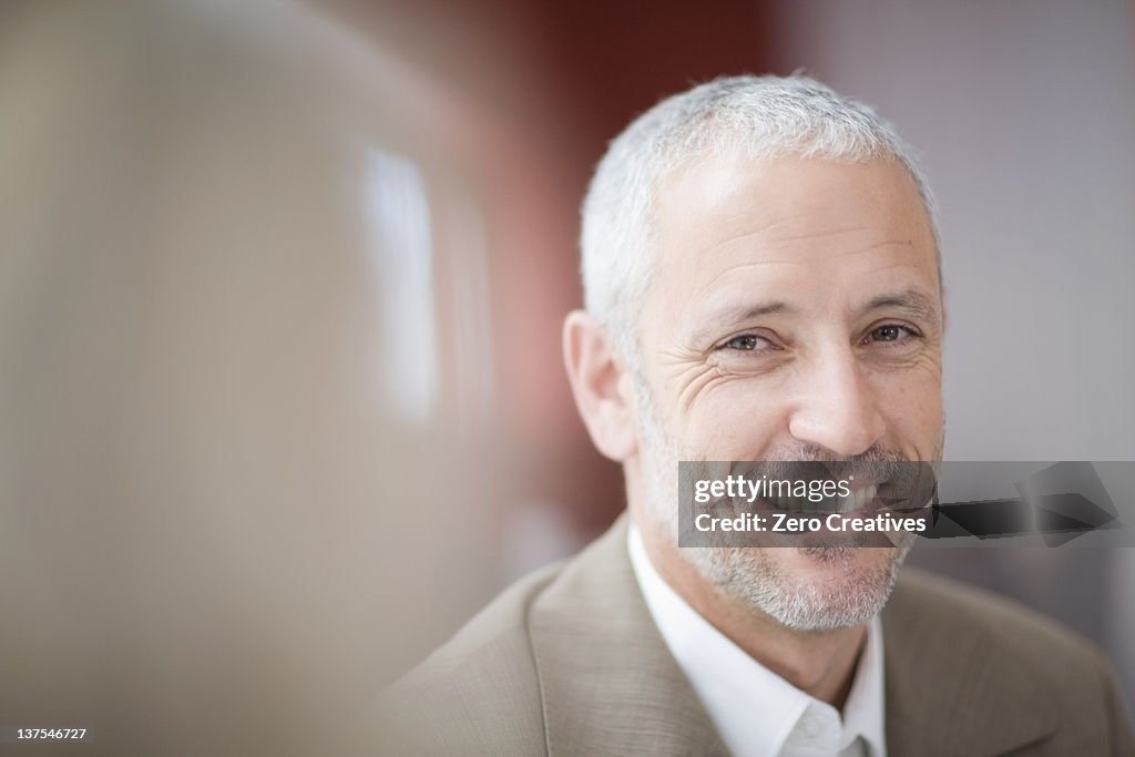 Close up of businessman's smiling face