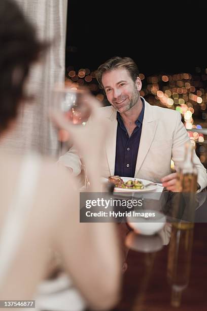 couple having romantic dinner at home - couple fine dining stock pictures, royalty-free photos & images