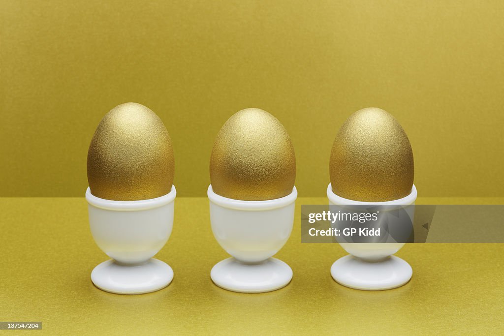 Golden eggs in egg cups