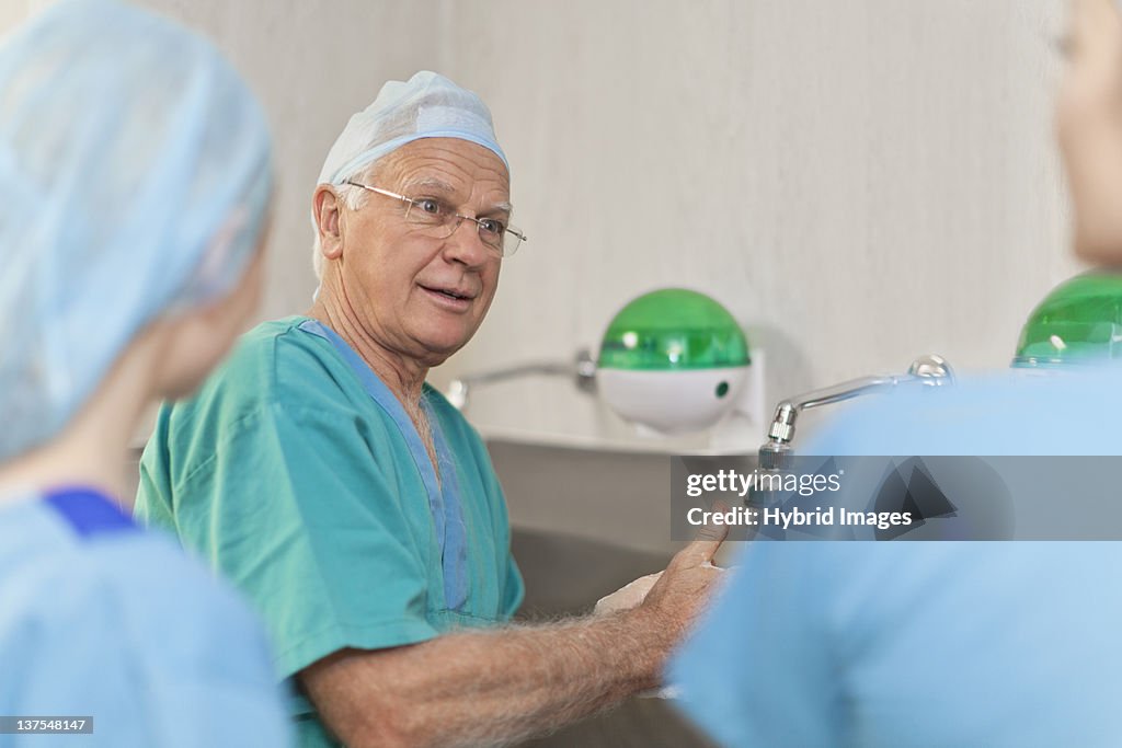 Surgeons washing hands before operation