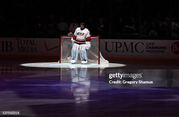 Cam Ward of the Carolina Hurricanes stands during the national anthem prior to the game against the Pittsburgh Penguins on January 17, 2012 at Consol...