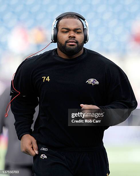 Michael Oher of the Baltimore Ravens warms up prior to their AFC Championship Game against the New England Patriots at Gillette Stadium on January...