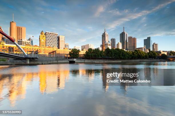 melbourne by the the yarra river at sunrise australia - river yarra stock pictures, royalty-free photos & images