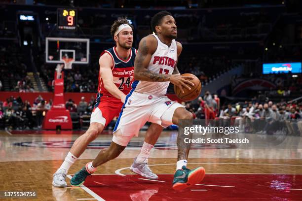 Rodney McGruder of the Detroit Pistons goes to the basket against Corey Kispert of the Washington Wizards during the first half at Capital One Arena...