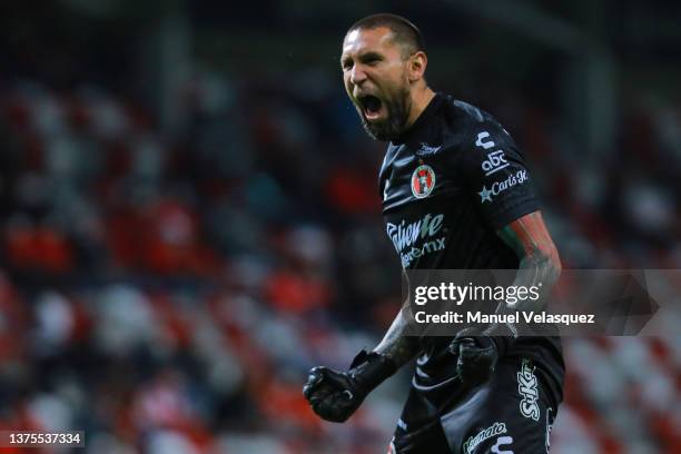 Jonathan Orozco of Tijuana celebrates the first scored goal of Tijuana scored by Marcel Ruiz during the 8th round match between Toluca and Club...