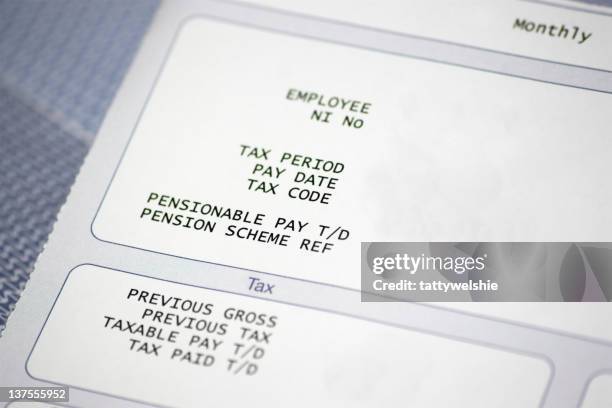 paper pay slip with tax and pension information - paycheck stock pictures, royalty-free photos & images