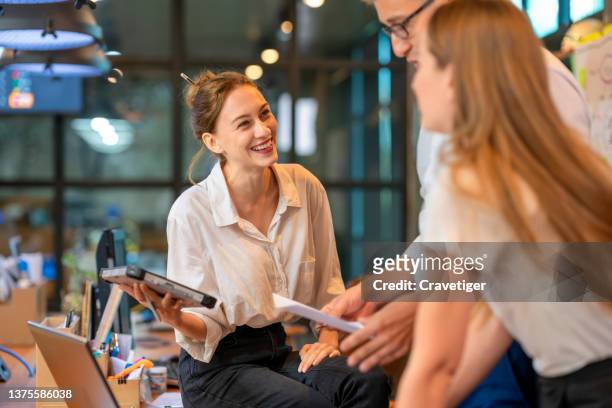 female manager having a meeting with business team to explain business plan in a business office . cooperation business concepts. - staff bonding stock pictures, royalty-free photos & images