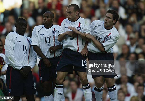 Emile Heskey, Trevor Sinclair, Danny Murphy and David Dunn of England in the wall during the International Friendly match between England and...