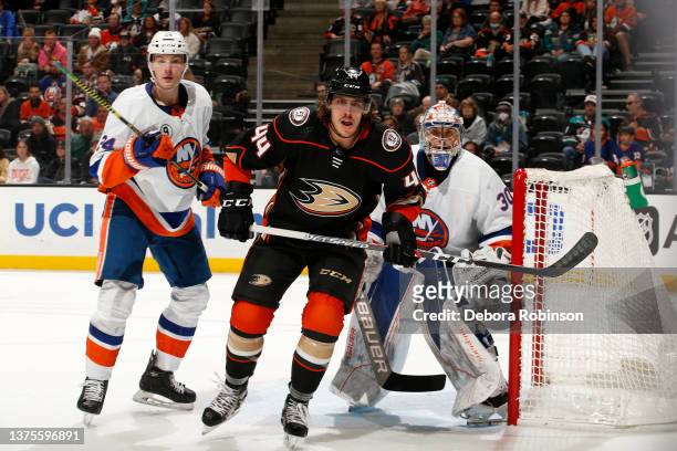 Max Comtois of the Anaheim Ducks battles for position against Scott Mayfield and Ilya Sorokin of the New York Islanders during the game at Honda...