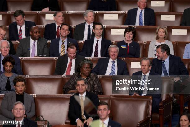 Members of U.S. President Joe Biden's cabinet and Republican Senators listen to Biden deliver the State of the Union address during a joint session...