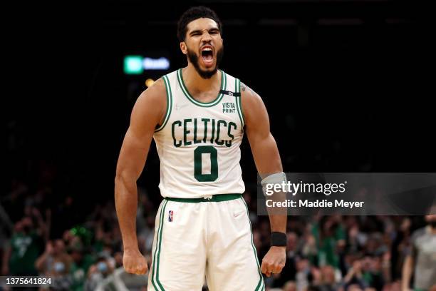 Jayson Tatum of the Boston Celtics celebrates after Grant Williams scored against the Atlanta Hawks at TD Garden on March 01, 2022 in Boston,...